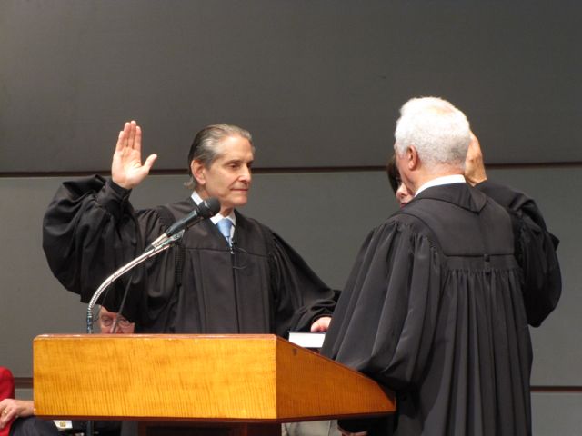 John B. Simon is sworn-in by Illinois Supreme Court Justice Charles E. Freeman.