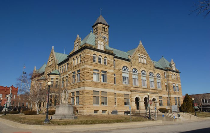 Coles county courthouse a tan building with a clocktower