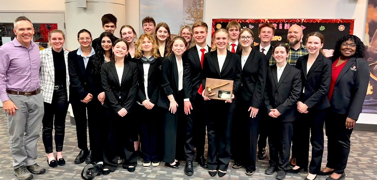 A photograph of the team from Timothy Christian High School with their coach and award 