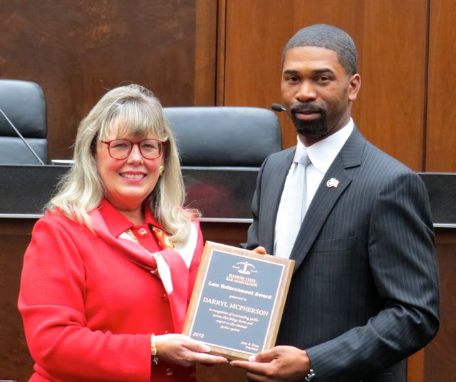 ISBA President-elect presents the Law Enforcement Award to Darryl K. McPherson.
