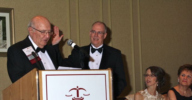 New ISBA President John E. Thies is sworn-in by his father, former ISBA President Richard L. Thies