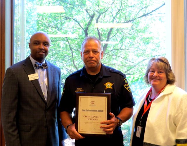 ISBA 3rd Vice President Vincent F. Cornelius (left) presented a Law Enforcement Award to Chief Daniel Hoffman, who was nominated by 16th Circuit Chief Judge Judith Brawka (right).