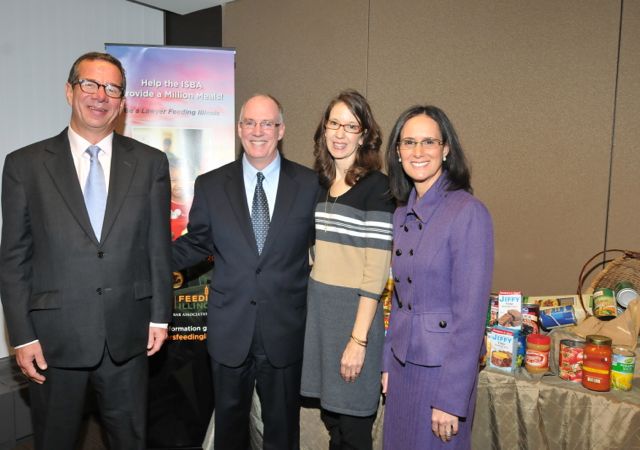 Attorney Title Guaranty Fund President Peter Birnbaum, ISBA President John Thies, Lawyers Feeding Illinois Chair Terry Thies and Illinois Attorney General Lisa Madigan attend the kickoff of Lawyers Feeding Illinois on Wednesday at the ISBA's Chicago Regional Office.