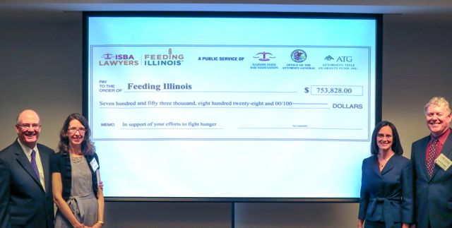 ISBA President John E. Thies, Lawyers Feeding Illinois Chair Terry Thies, Illinois Attorney General Lisa Madigan and St. Louis Area Food Bank Executive Director Frank Finnegan with the check for $753,828.