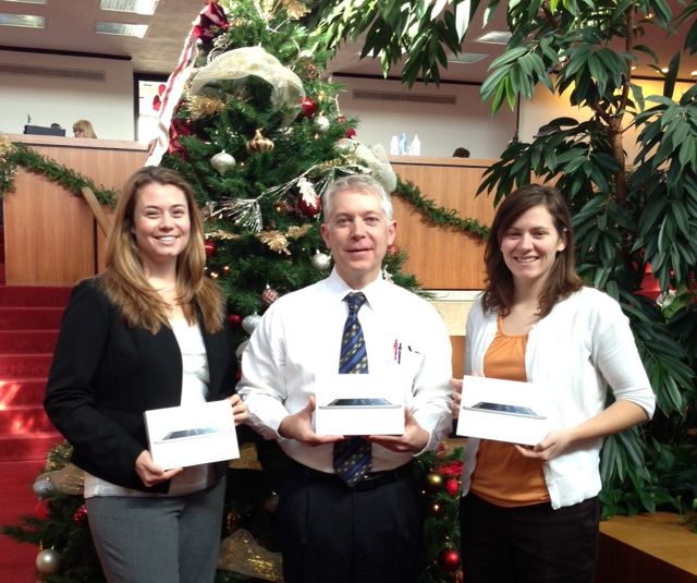 ISBA staffers Lynne Davis, Charles Northrup and Bailey Cunningham display the three iPad Minis to be awarded for the Membership is Tweet campaign.