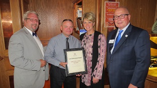 Illinois State Bar Association 2nd Vice President James F. McCluskey (far right) presented an ISBA Law Enforcement Award to Illinois Department of Conservation Officer Hank Frazier (second from left) on Oct. 18 at JJ’s Pub in Ottawa. (Also pictured: James T. Reilly [far left] and LaSalle County Bar Association President Michelle A. Vescogni [second from right]). 