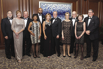 Bob Craghead and the ISBA officers, pictured with their wives (Susan Hartigan, Zina Cornelius, Jan Davi, Jeanne McCluskey, and Marnell Felice).
