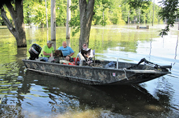 From left to right: Curt Peters, Steven Margherio, and Calhoun County Public Defender Scott Schultz docking near Hardin, Illinois, on June 11.