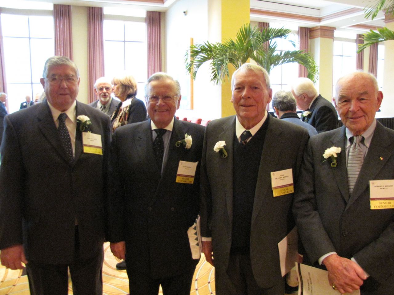 (Click to enlarge) Four Senior Counsellors reunite before the luncheon.