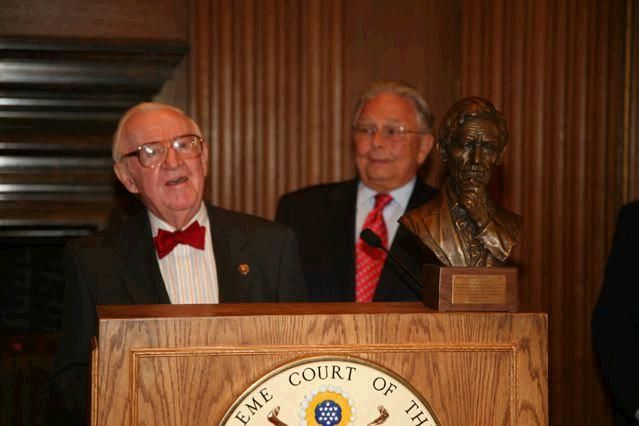 Justice John Paul Stevens accepts a replica of the Abraham Lincoln bust the ISBA commissioned for the Lincoln bicentennial from ISBA President Jack Carey. 