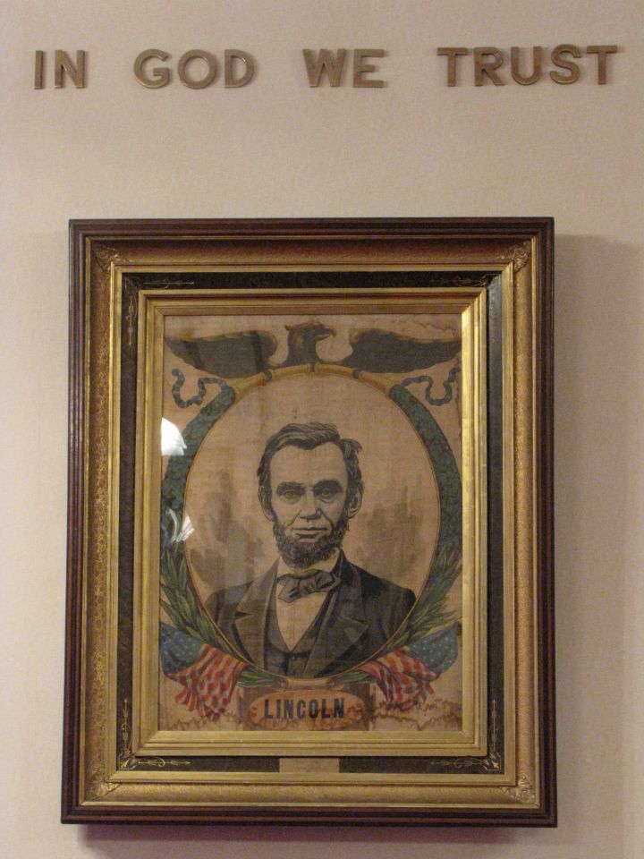 An image of Abraham Lincoln sits on the wall opposite ...