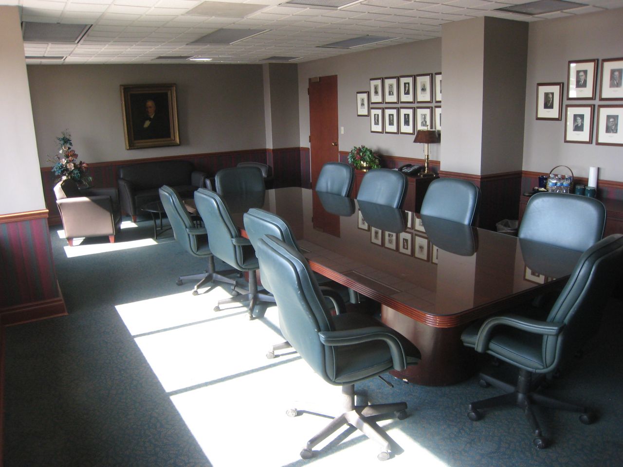 Main conference room with firm leaders (including Abraham Lincoln) pictured on wall