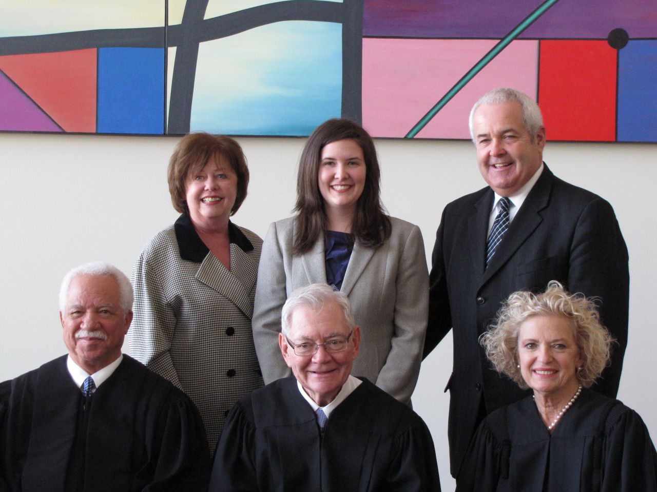 Front row: Justices Freeman, Fitzgerald and Burke. Back row: ISBA member Al Durkin (right) with his wife, Kathy, and daughter Jessica, who was admitted to the bar on Thursday.