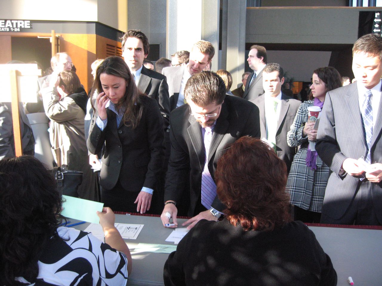 New admittees sign in before the ceremony.