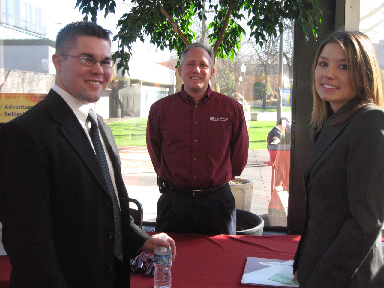 New admittees Sean Weppler (left) of Libertyville and Angela Stinebrink (right) of Plano with ISBA Mutual's Kurt Bounds