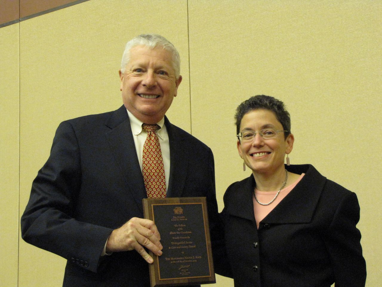 IBF past president David Sosin presents the Distinguished Service to Law & Society Award to Judge Nancy J. Katz