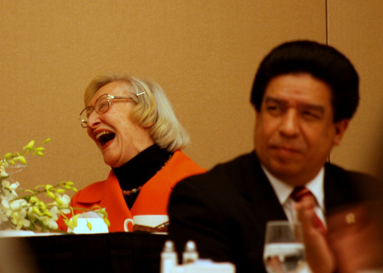 Dawn Clark Netsch enjoys a laugh as Cook County Judge Jesse Reyes looks on.