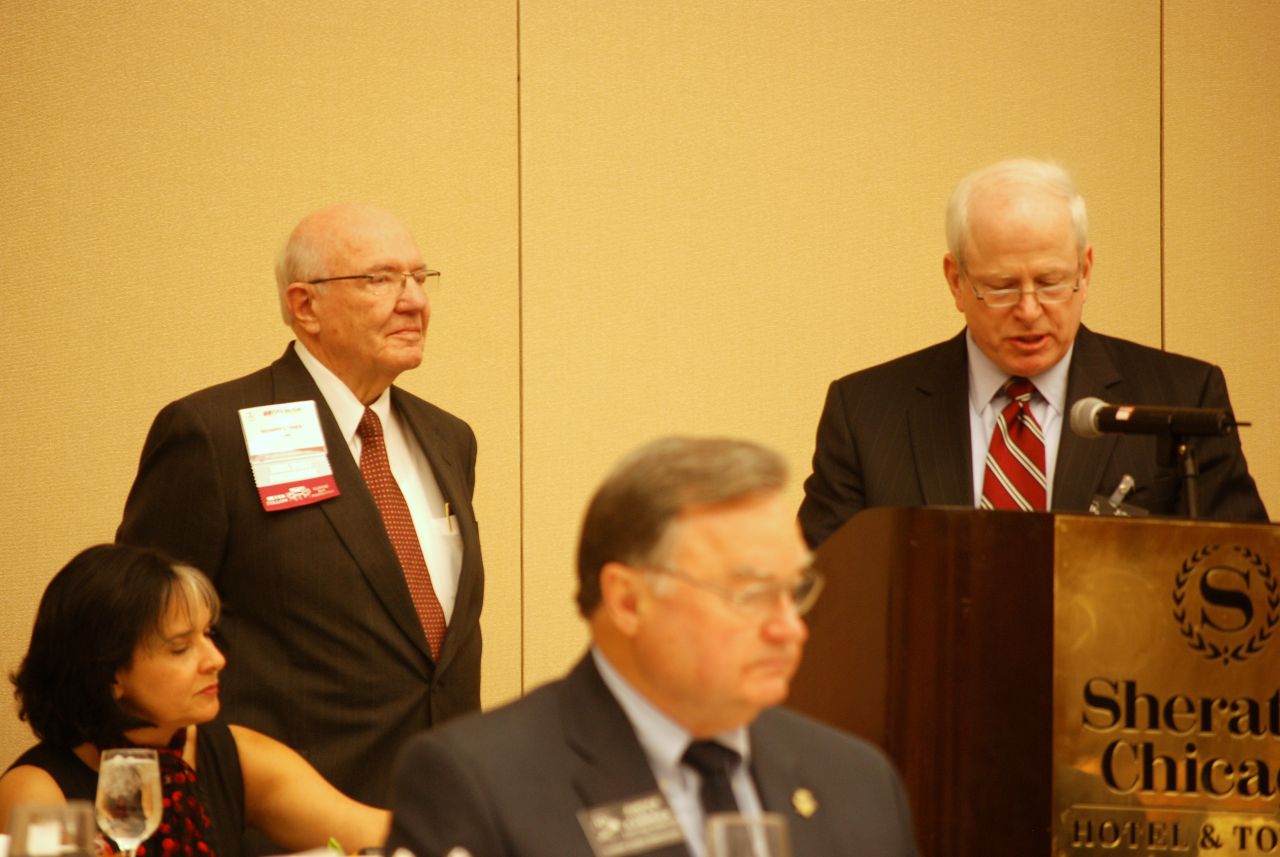 Supreme Court Justice Lloyd Karmeier (middle) listens as IJA President Ronald D. Spears (right) presents the Founders Award to ISBA past president Richard L. Thies.