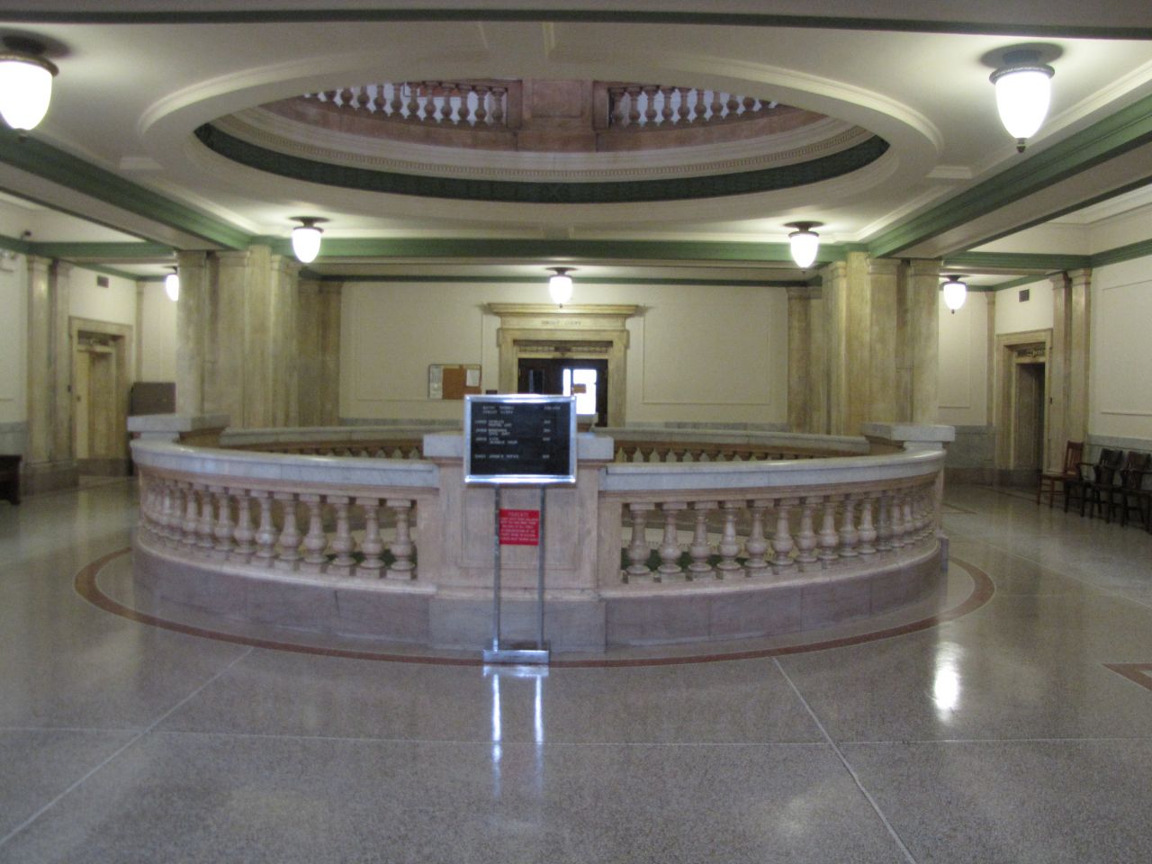 Marble railings are the centerpiece of the second and third floors.