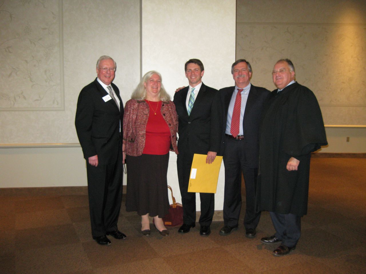 ISBA President John O'Brien, Deb Baron, her son, new admittee David Baron, his father, ISBA member Dennis Baron and Justice Robert L. Carter