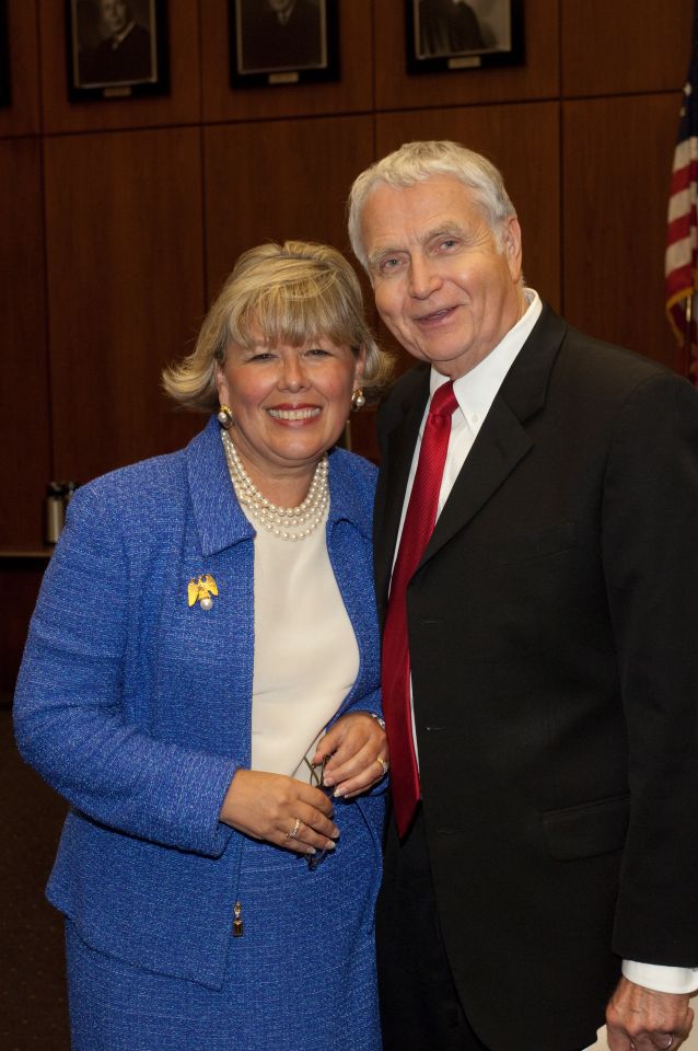 New initiate Paula Holderman is congratulated by Bob Downs