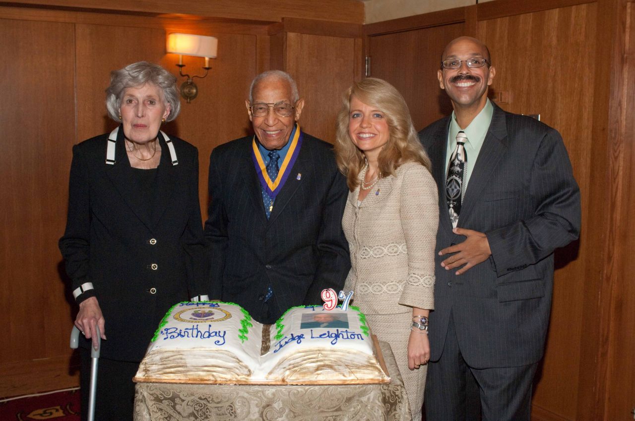 Justice Mary Ann G. McMorrow, Michele Jochner and Pierre Priestley congratulate Judge Leighton on his 97th birthday.
