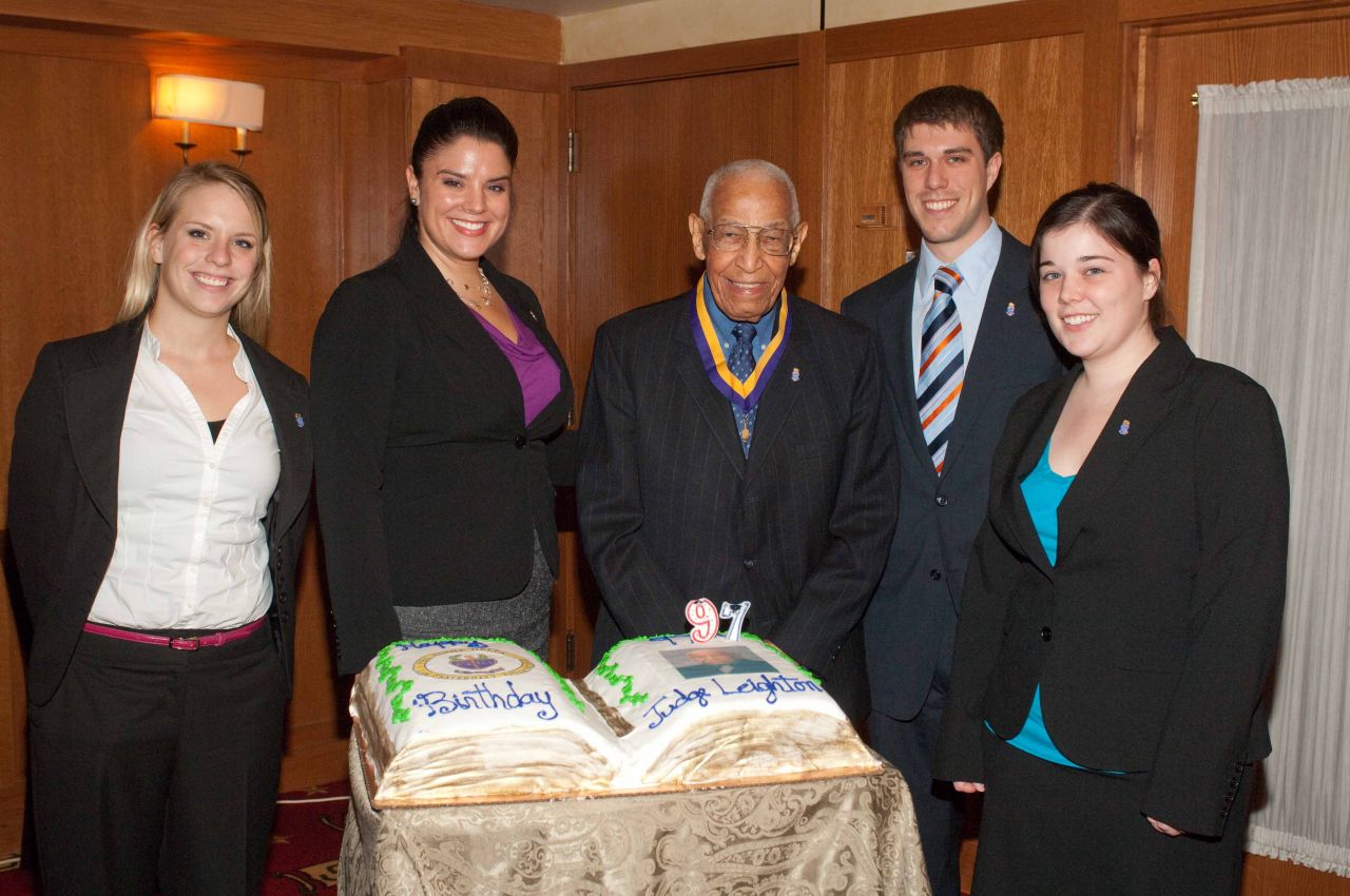 Judge Leighton is congratulated by student members of the PAD Lincoln Chapter at The John Marshall Law School.