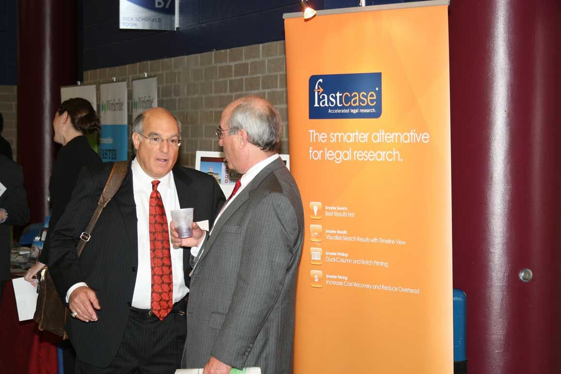 Mark Hassakis, ISBA's President Elect, converses with attendees in the Exhibitor's hall.