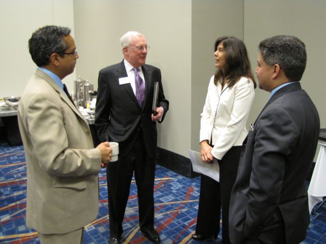 President O'Brien speaks with CBA President Alvarez as Leo Lastre and Puerto Rican Bar Association President Enrique Abraham look on.