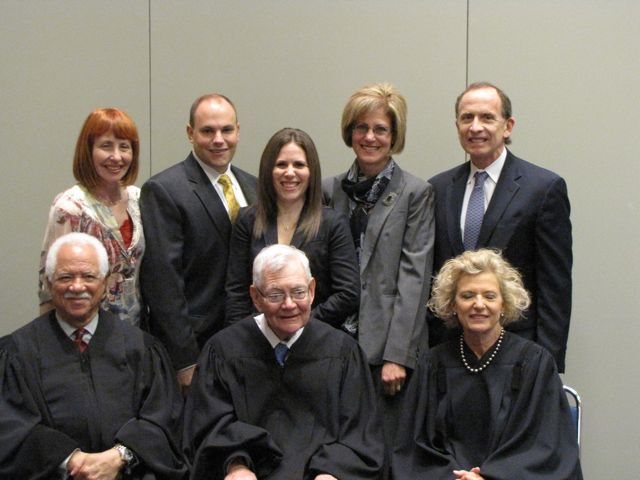 New admittee Michele Rajfer (rear, center) and family with the justices.