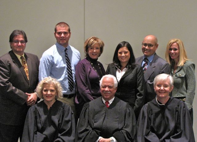 New admittee Lauren Davalle with her family and the justices.