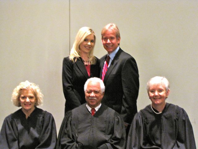 New admittee Shauna Martin with her father, ISBA member Jeffrey Martin and the justices.