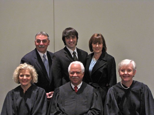 New admittee Michael Pellegrino with his father, ISBA member Richard Pellegrino, his mother and the justices.