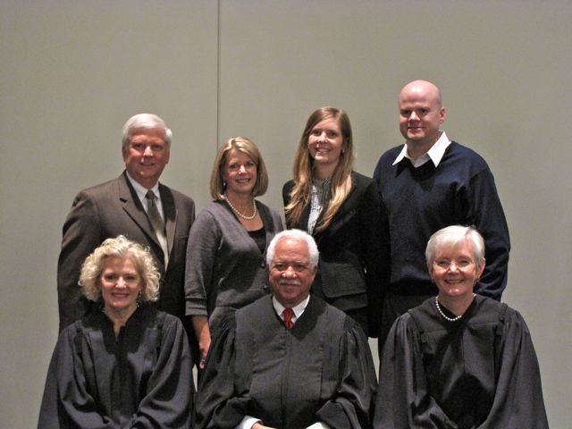 New admittee Michelle Olson with her family and the justices.