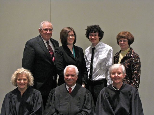 New admittee Colette Willer with her family and the justices.
