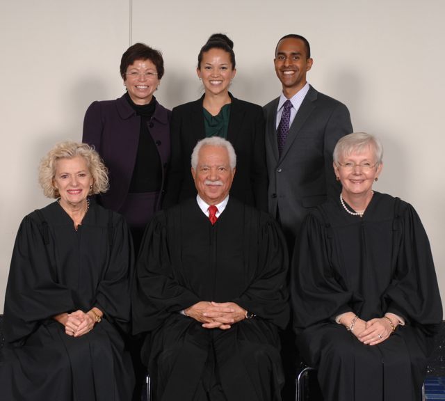 White House senior advisor Valerie Jarrett with her daughter, new admittee Laura Jarrett and friend Anthony Balkissoon pose with Justices Anne Burke, Charles Freeman and Mary Jane Theis.