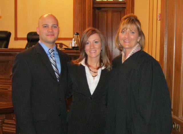 New admittee Jon Giraudo, his wife, new admittee Kelly Giraudo and Justice Mary K. O'Brien