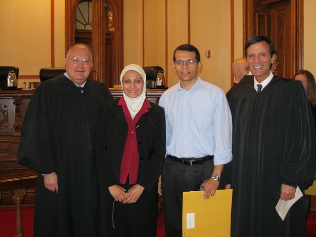 Justice Robert L. Carter, new admittee Mona Elgindy, her husband, Waleed Gabr and Justice Tom M. Lytton.