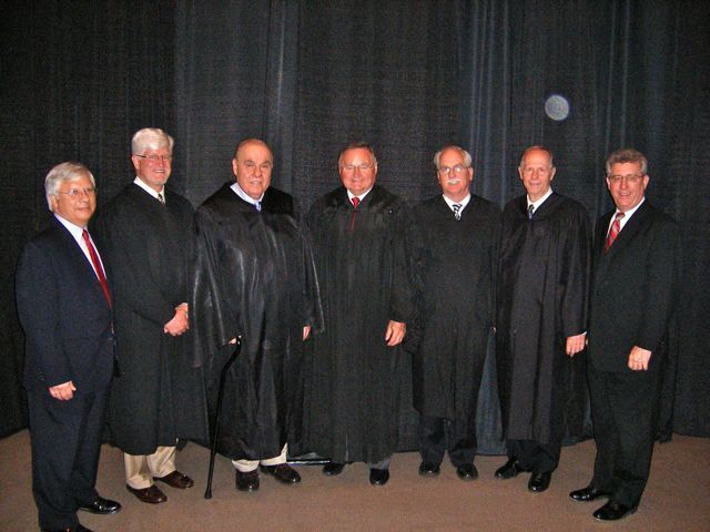 Justices and speakers for the Fifth District ceremony in Collinsville. ISBA Secretary Carl Draper is at the far right.