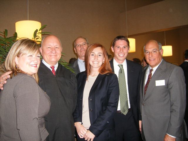 New admittee Rachael Moore Keehn (from left) with her father, Judge James R. Moore, new admittees Elizabeth Dahlmann and Mark Beatty with Mark's dad Bill Beatty (rear) and ISBA President Hassakis