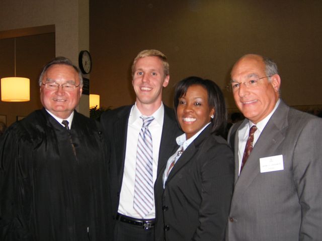 New admittees Tameeka L. Purchase and Gary S. Peeples (center) visit with Justice Lloyd A. Karmeier (left) and ISBA President Mark D. Hassakis after being sworn in at the 5th District Ceremony