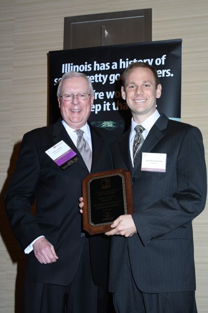 President O'Brien presents a Lincoln Legal Writing Award to Geoffrey T. Burkhart