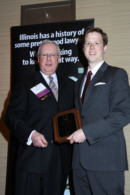 President O'Brien presents a Lincoln Legal Writing Award to Samuel G. Wieczorek