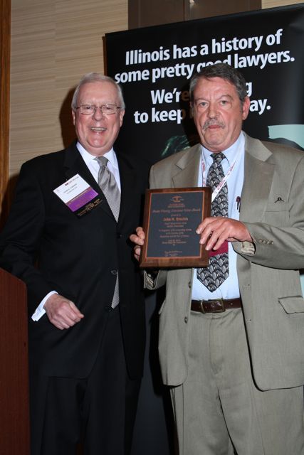 President O'Brien presents the Austin Fleming Newsletter Editor Award to John H. Brechin
