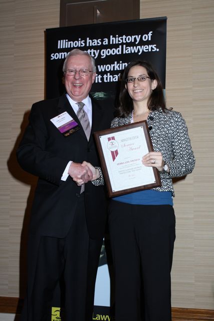 President O'Brien presents a 5-year Newsletter Service Award to Debra Liss Thomas
