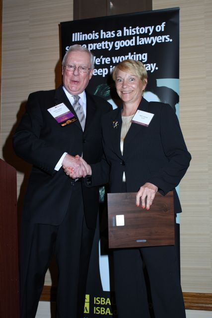 President O'Brien presents a 5-year Newsletter Service Award to Katarinna McBride (accepted on her behalf by Mary Cascino)