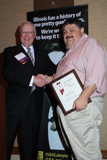 President O'Brien presents a 5-year Newsletter Service Award to Bryan M. Sims