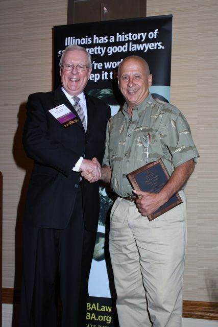 President O'Brien presents a 10-year Newsletter Editor Service Award to Richard Hannigan