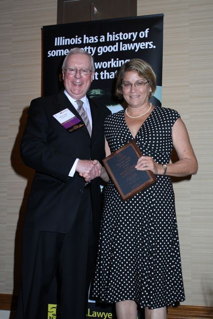 President O'Brien presents a 10-year Newsletter Service Award to Kathryn A. Kelly