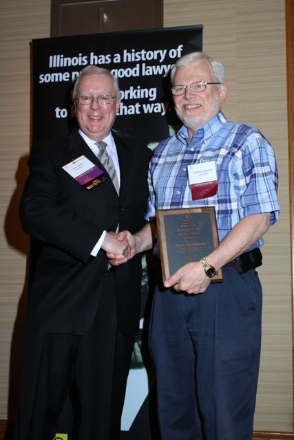 President O'Brien presents a 10-year Newsletter Service Award to Alfred M. Swanson